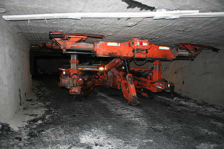 First Place Bolting up the earth Roof bolter set up to install bolts in an underground coal mine. TRS (temporary roof support) is used hydraulically to hold roof from collapsing or falling out while holes are drilled and bolts installed for roof support. Submitted by Frank Fetty, CFPMHM