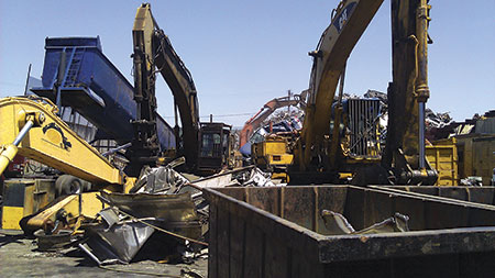Third Place  Metal dinosaurs Scrap metal is trucked in and off-loaded using an end dump trailer. Bigger pieces are cut by a CAT 330 excavator with shears attachment then sorted and piled high by a Hitachi 450 excavator with claw attachment at Rumetco, a recycling plant in Wilmington, CA. None of this would be possible if not for the power of hydraulics. Submitted by Andy Zepeda, CFPCC
