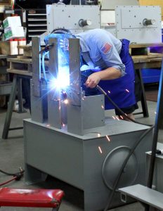 (5): Scott Industrial’s production team welds together a power unit - submitted by Jenny Westfall, Scott Industrial Systems