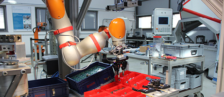Utilization of Sensitive Compliant Lightweight Robot Arms for Hydraulic Valve Assembly