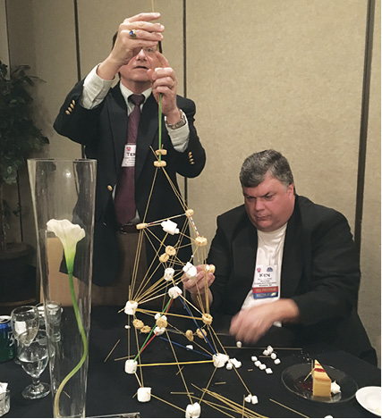 Terry Christopher and Ken Dulinski build their tower